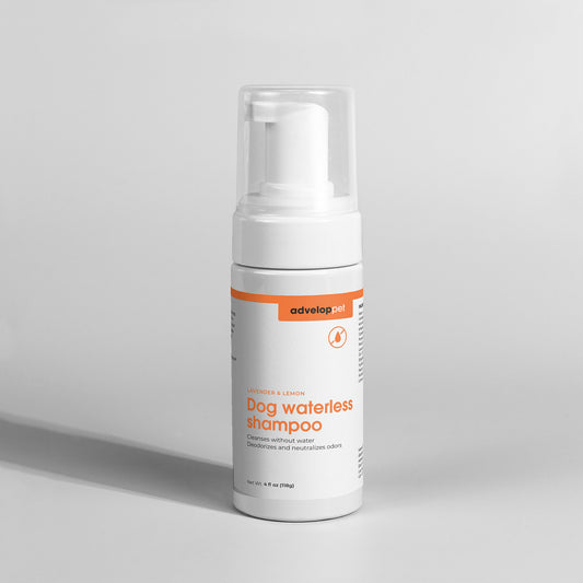 A bottle of Dog Waterless Shampoo with a pump dispenser, labeled with the Advelop Pet brand and product name.